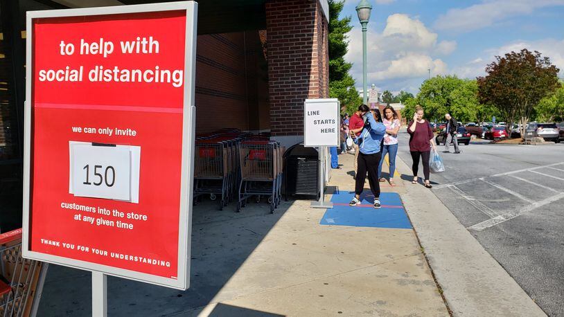 Metro Atlanta retailers have put new safety measures in place during the coronavirus pandemic. Shoppers had to wait outside a T.J. Maxx store in Gwinnett County to avoid exceeding limits on how many people were allowed to be inside at one time. MATT KEMPNER / AJC FILE PHOTO