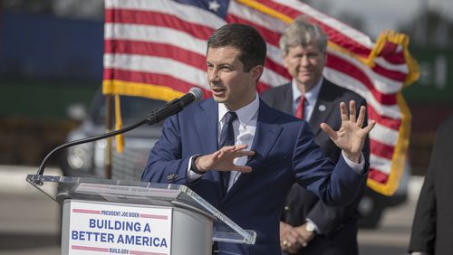 U.S. Transportation Secretary Pete Buttigieg speaks to the media during his visit to the Georgia Ports Authority's Megarail facility on Friday. Buttigieg's visit highlighted recent coordination with the U.S. Department of Transportation and the Georgia Ports Authority to improved its cargo flow by increasing rail capacity and activating flexible "pop-up" container yards near manufacturing and distribution centers. (AJC Photo/Stephen B. Morton)
