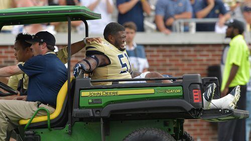Georgia Tech defensive lineman Jahaziel Lee reacts as he is carried off the field after his injury at Bobby Dodd Stadium on Saturday, September 14, 2019. (Hyosub Shin / Hyosub.Shin@ajc.com)