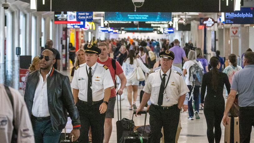 People make their way through Concourse A at Hartsfield-Jackson Atlanta International Airport Wednesday, June 22, 2022. Steve Schaefer / steve.schaefer@ajc.com)