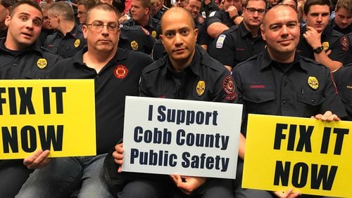 In this file photo, Cobb public safety employees urged the BOC to increase pay and benefits (Meris Lutz/AJC)