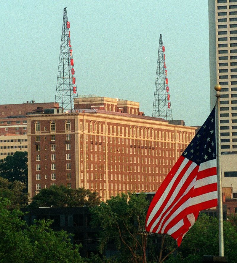 The Biltmore Hotel lit up the radio towers on the roof for the first time in years in this photo from 2004, changing the city skyline. The hotel is located between 5th and 6th Street on West Peachtree Street. AJC File Photo