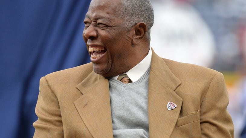 Hank Aaron laughs during a pregame ceremony to recognize the 40th anniversary of Hank Aaron's historic 715th home run before the season opener Tuesday, April 8, 2014, at Turner Field in Atlanta. (HYOSUB SHIN / AJC)
