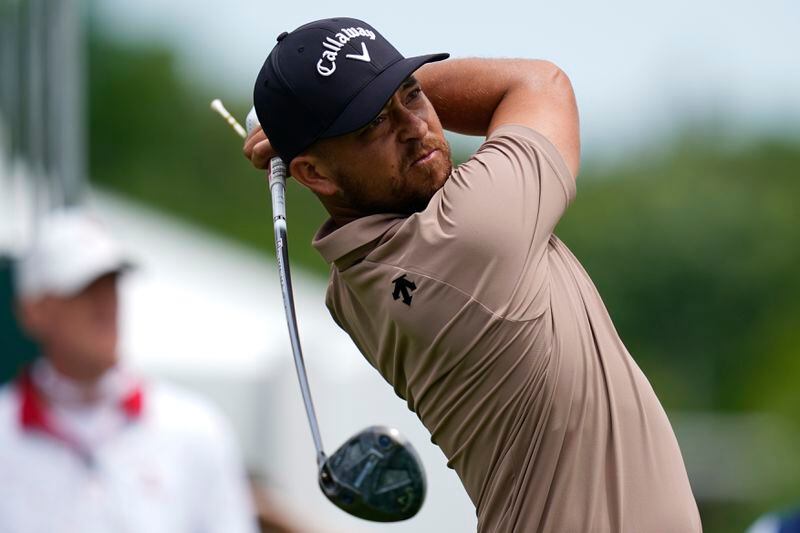 Xander Schauffele watches his tee shot on the 10th hole during the first round of the Wells Fargo Championship golf tournament at the Quail Hollow Club Thursday, May 9, 2024, in Charlotte, N.C. (AP Photo/Erik Verduzco)