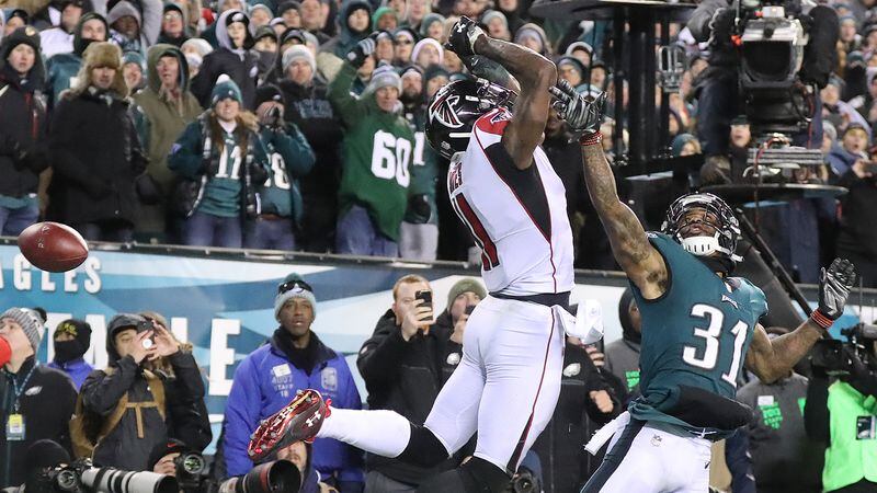 The ball flies past Falcons wide receiver Julio Jones on a fourth down attempt from Matt Ryan with Jalen Mills defending in the end zone in the final minute of the NFC Divisional Playoff Saturday, Jan. 13, 2018, in Philadelphia.