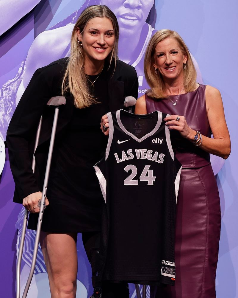 Virginia Tech's Elizabeth Kitley, left, poses for a photo with WNBA commissioner Cathy Engelbert, right, after being selected 24th overall by the Las Vegas Aces during the second round of the WNBA basketball draft on Monday, April 15, 2024, in New York. (AP Photo/Adam Hunger)