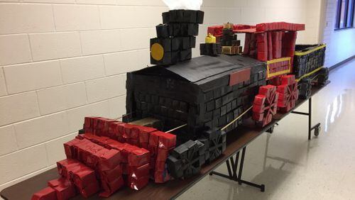 This is "Little General" — a locomotive model made from 1,000 recycled milk cartons by Valerie King's second-grade class at Kennesaw Elementary. The school won $1,000 from Evergreen Packaging for the "invention."