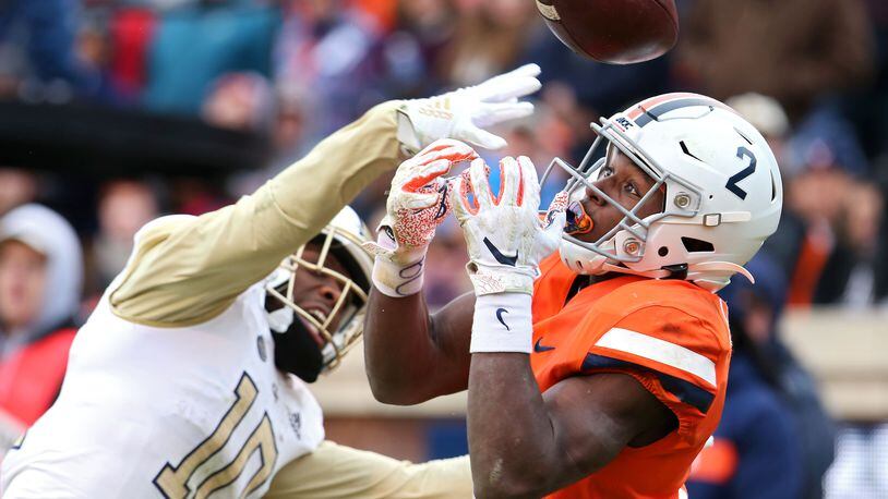 Christian Campbell (left)  of the Georgia Tech Yellow Jackets breaks up a pass intended for Joe Reed of the Virginia Cavaliers in the end zone. (Photo by Ryan M. Kelly/Getty Images)