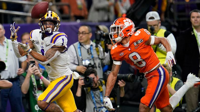 LSU wide receiver Ja'Marr Chase catches a touchdown pass in front of Clemson cornerback A.J. Terrell during the first half of the national championship game Monday, Jan. 13, 2020, in New Orleans.