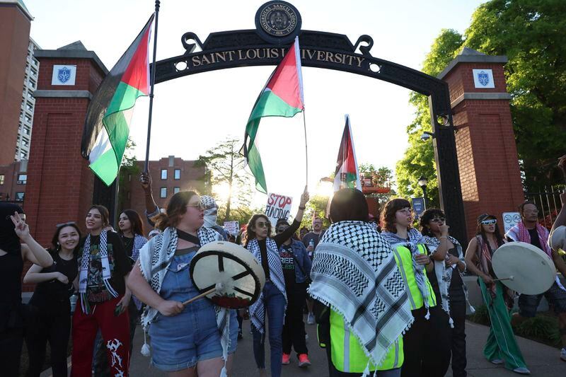 Pro-Palestinian protesters begin to march on the campus of St. Louis University, Wednesday, May 1, 2024, in St. Louis. (David Carson/St. Louis Post-Dispatch via AP)