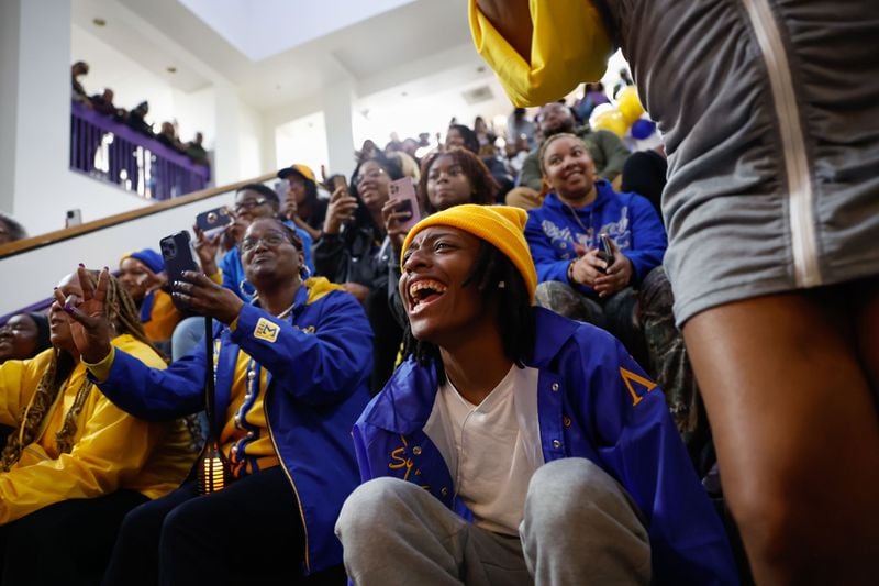 Members of Sigma Gamma Rho Sorority Inc. cheer as Amaris Johnson comes out as the newest member of the Beta Lambda chapter at Morris Brown College on Friday, March 22, 2024. The sorority will be the first on campus in more than 20 years. (Natrice Miller/ Natrice.miller@ajc.com)