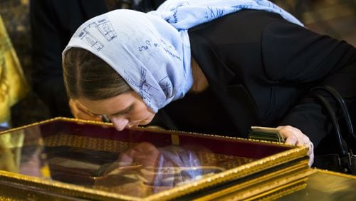 A Russian Orthodox believer kisses the relics of St. Nicholas Friday, May 26, 2017, at Christ the Savior Cathedral in Moscow. The bones, believed to belong to the saint and held in a gilded ark, were brought to Russia from an Italian church where they have lain for 930 years.