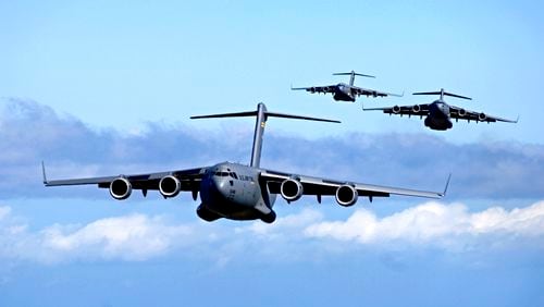 This image provided by the US Air Force shows C-17 Globemasters from the 535th Airlift Squadron, Hickam Air Force Base, Hawaii participating in an airdrop training mission May 16, 2006. A Macon Boeing plant was once part of the program. That plant, which had been slated to covert into a commercial aviation facility, will now close at the end of the year. (AP Photo/US Air Force - Tech. Sgt. Shane A. Cuomo)