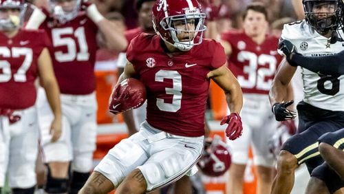 Alabama wide receiver Jermaine Burton (3) looks for running room against Vanderbilt during the first half of an NCAA college football game Saturday, Sept. 24, 2022, in Tuscaloosa, Ala. (AP Photo/Vasha Hunt)