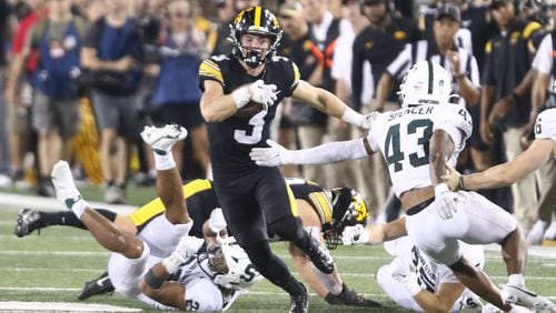 Iowa defensive back Cooper DeJean (3) runs back a punt return during the second half against Michigan State at Kinnick Stadium on Sept. 30, 2023, in Iowa City, Iowa. (Matthew Holst/Getty Images/TNS)