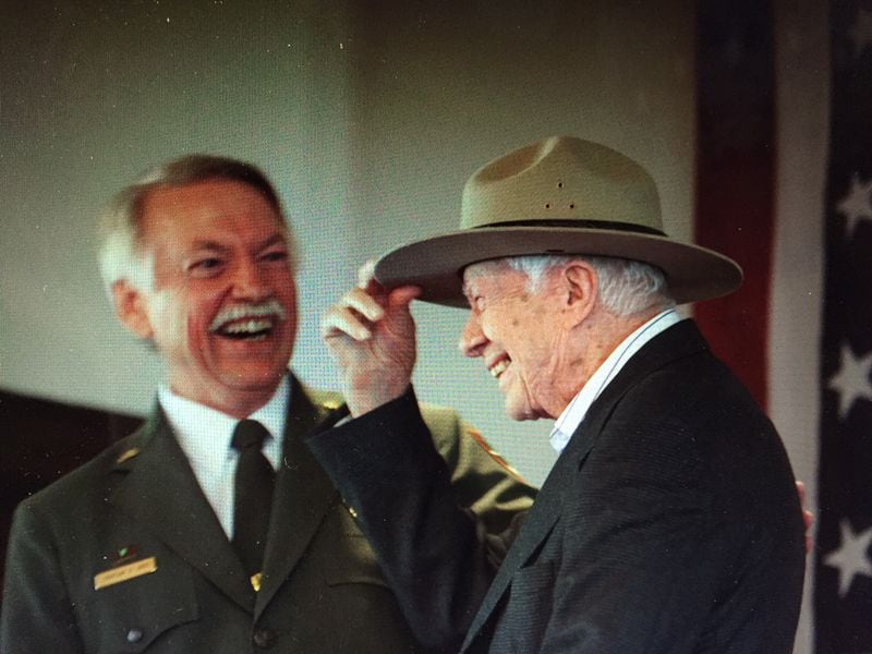 National Park Service Director Jonathan B. Jarvis gives Jimmy Carter his own iconic ranger hat during a ceremony in Plains where the former president was made an honorary national park ranger. Photo by Jill Stuckey