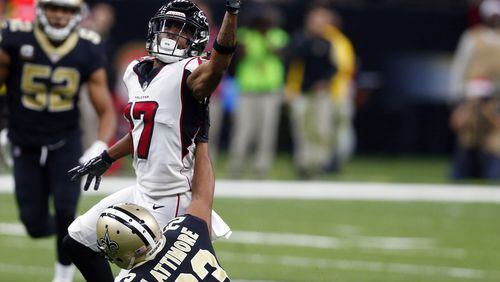 New Orleans Saints cornerback Marshon Lattimore (23) forces an interception off the hands of Atlanta Falcons wide receiver Marvin Hall (17) in the first half of an NFL football game in New Orleans, Sunday, Dec. 24, 2017. (AP Photo/Butch Dill)