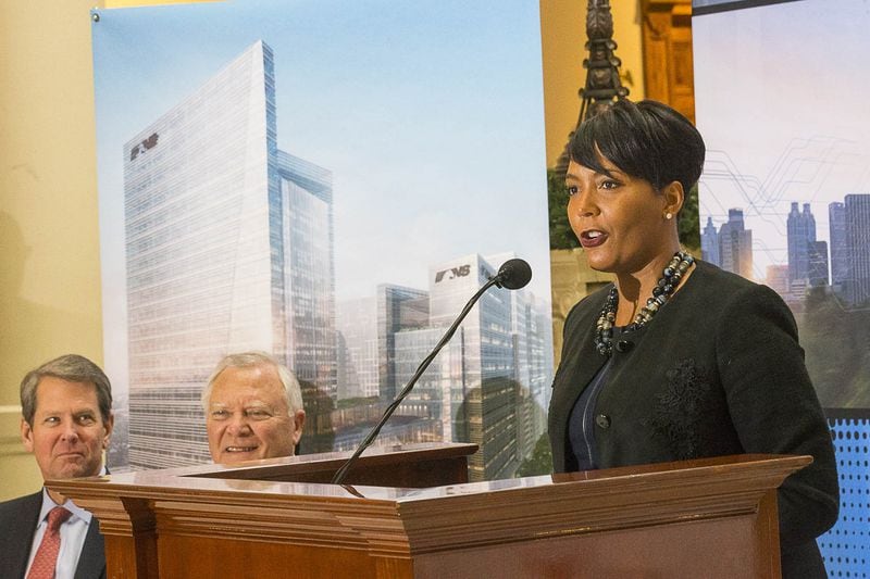 12/12/2018 — Atlanta, Georgia — Georgia Governor-Elect Brian Kemp (left), Governor Nathan Deal (center) listen as Atlanta Mayor Keisha Lance Bottoms (right) speaks during a press conference in the Georgia State Capitol building in Atlanta, Wednesday, December 12, 2018. During the presser, Fortune 500 company Norfolk Southern officially announced that they will be moving their headquarters to Atlanta. They will be building in Atlanta’s Midtown community. (ALYSSA POINTER/ALYSSA.POINTER@AJC.COM)