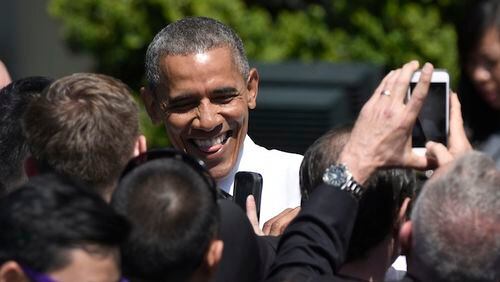 President Barack Obama greets guests on the South Lawn of the White House in Washington, Thursday, April 14, 2016, during a ceremony for the start of the Wounded Warrior Ride. The ride is to raise awareness of our nation's heroes who battle the physical and psychological damages of war. (AP Photo/Susan Walsh)