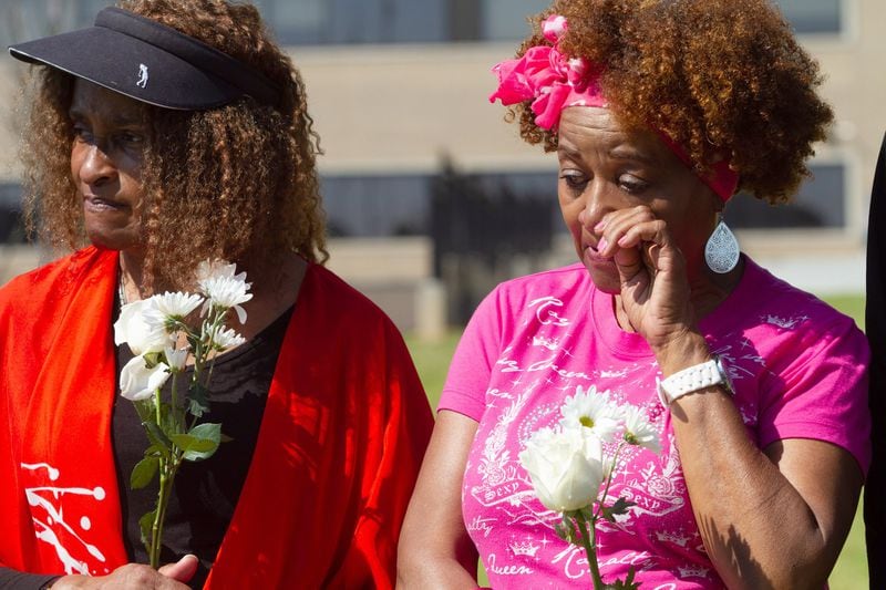 Joyce Finch-Morris (right), a relative of Thomas Finch, gets emotional during a ceremony by the Fulton County Remembrance Coalition near Grady Memorial Hospital. STEVE SCHAEFER / SPECIAL TO THE AJC