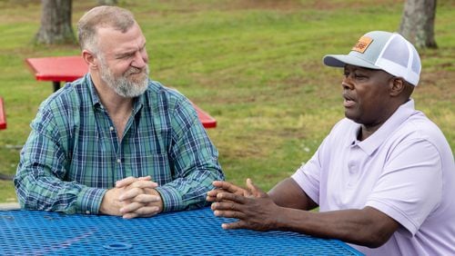 Randy Simpkins (left) and Russell Dallas chat at Hunter Park in Douglasville. Simpkins, a pastor and businessman from Carrollton, never met Dallas, who is from Douglasville before he committed to being tested to be a kidney donor for Dallas.   PHIL SKINNER FOR THE ATLANTA JOURNAL-CONSTITUTION