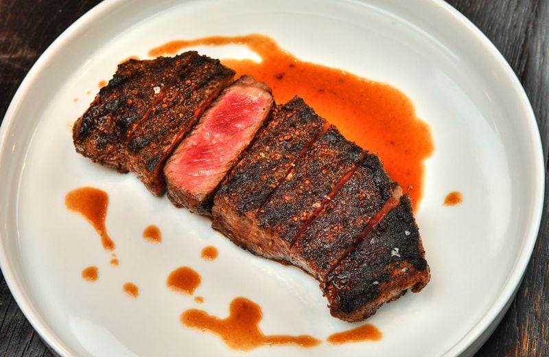 A 12-ounce NY Strip is one of the things at the heart of the menu at Cattle Shed Wine & Steak Bar. (Chris Hunt for The Atlanta Journal-Constitution)