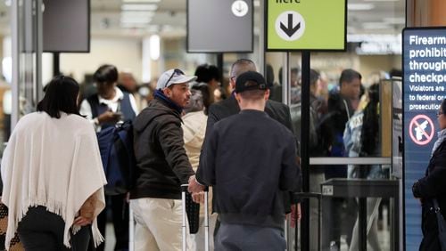 Passengers enter the Domestic North Checkpoint on January 11, 2019, as TSA employees continued to work the security lines at Hartsfield-Jackson International Airport as the federal shutdown continued.   (Photo: Bob Andres / bandres@ajc.com)