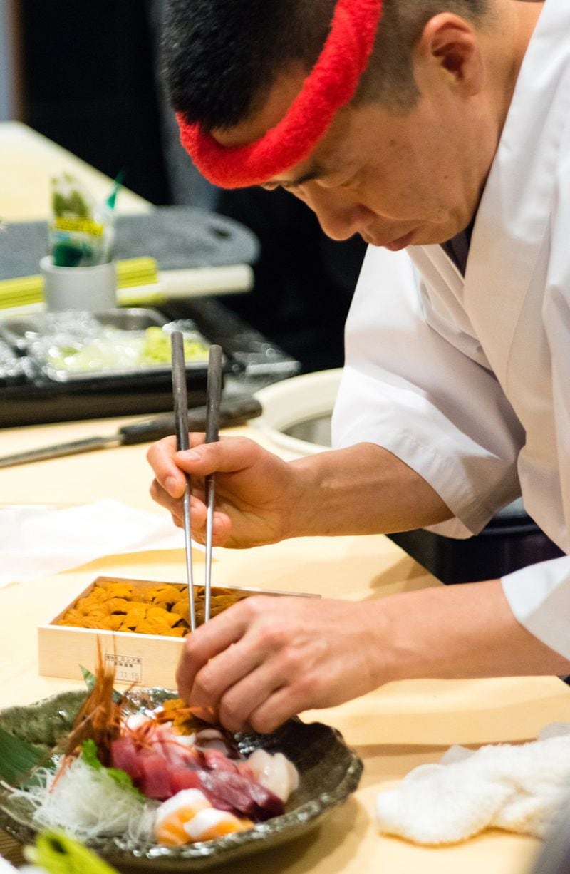 Chef Art Hayakawa plates the sashimi taku jyo. CONTRIBUTED BY HENRI HOLLIS