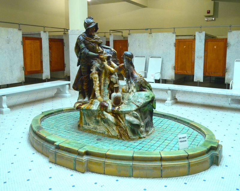 A statue depicts explorer Hernando de Soto receiving water from an indigenous American Indian woman in the men's bath hall at the Fordyce bathhouse in Hot Springs National Park. 
Courtesy of Wesley K.H. Teo