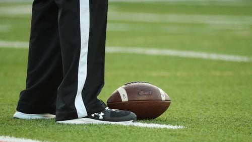 Sept. 2, 2020 - Canton, Ga: A referee stands over a football during a break in the action between Carver-Atlanta and Cherokee Wednesday, Sept. 2, 2020, at Cherokee High School in Canton. (Jason Getz/For the AJC)