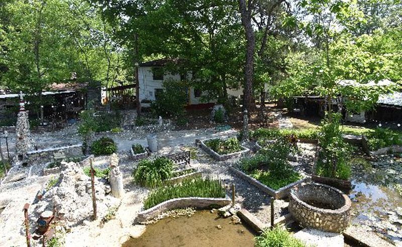 The water is flowing again around the Mosaic Garden in Howard Finster's folk art environment in the community of Pennville, outside Summerville. HYOSUB SHIN / HSHIN@AJC.COM