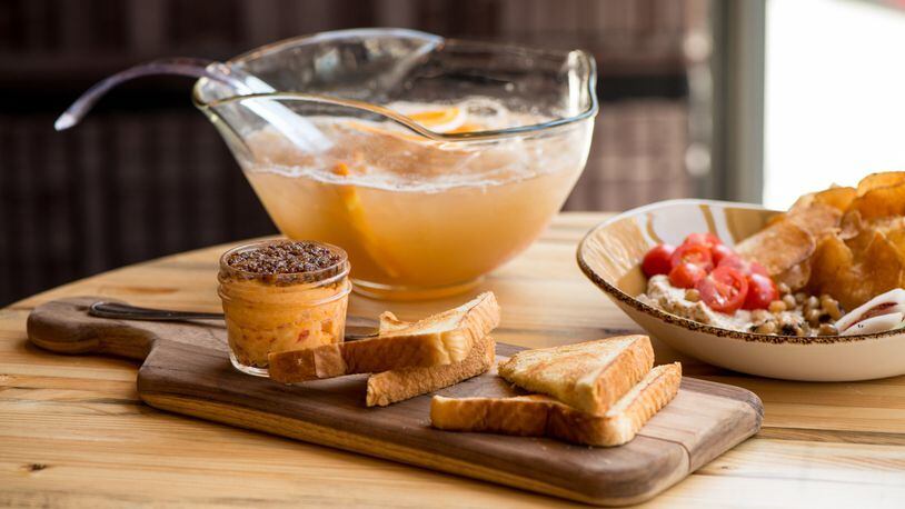 Punch Bowl Social Hugh's Pimiento Cheese with "Tender Belly" bacon marmalade and Pullman toast. Photo credit- Mia Yakel.
