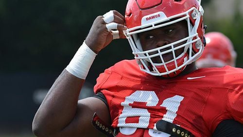 Georgia offensive lineman Chris Barnes (61) was wearing the No. 97 on Tuesday and was working with the defensive line.