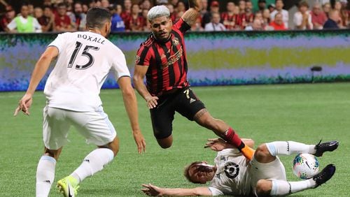 August 27, 2019 Atlanta: Atlanta United forward Josef Martinez collides with Minnesota United defender Chase Gasper in the final for the U.S. Open Cup on Tuesday, August 27, 2019, in Atlanta.  Curtis Compton/ccompton@ajc.com