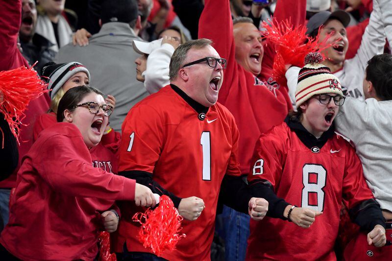 Georgia Bulldogs fans cheer during the first quarter against the Alabama Crimson Tide at the 2022 College Football Playoff National Championship at Lucas Oil Stadium in Indianapolis on Monday, January 10, 2022.   Hyosub Shin / Hyosub.Shin@ajc.com 