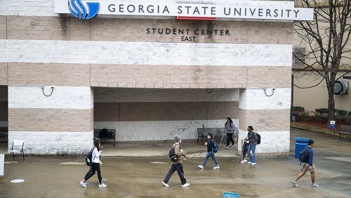 Students navigate Georgia State University’s main campus in Atlanta on March 10, 2020, in the final days before the university shifted its instruction online. AJC file photo ALYSSA POINTER/ALYSSA.POINTER@AJC.COM
