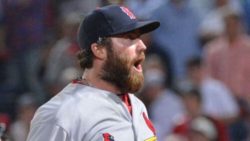 The Braves purchased the contract of former St. Louis Cardinals pitcher Jason Motte and optioned third catcher Anthony Recker to Triple-A to open a spot on the 25-man roster.