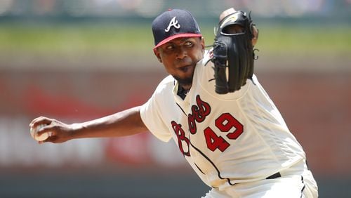Julio Teheran delivers a pitch in the first inning Sunday, when he took a two-hit shutout to the seventh against the Diamondbacks. (Photo by Todd Kirkland/Getty Images)