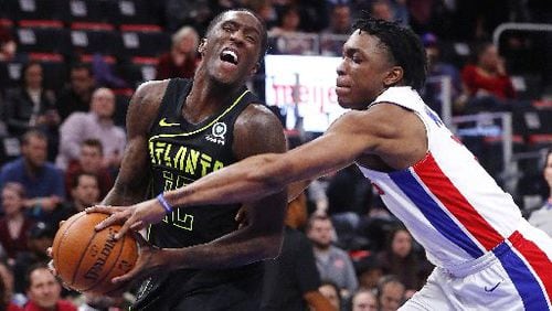 Hawks forward Taurean Prince (12) is fouled by Detroit Pistons forward Stanley Johnson (7) in the first half of an NBA basketball game in Detroit, Wednesday, Feb. 14, 2018. (AP Photo/Paul Sancya)