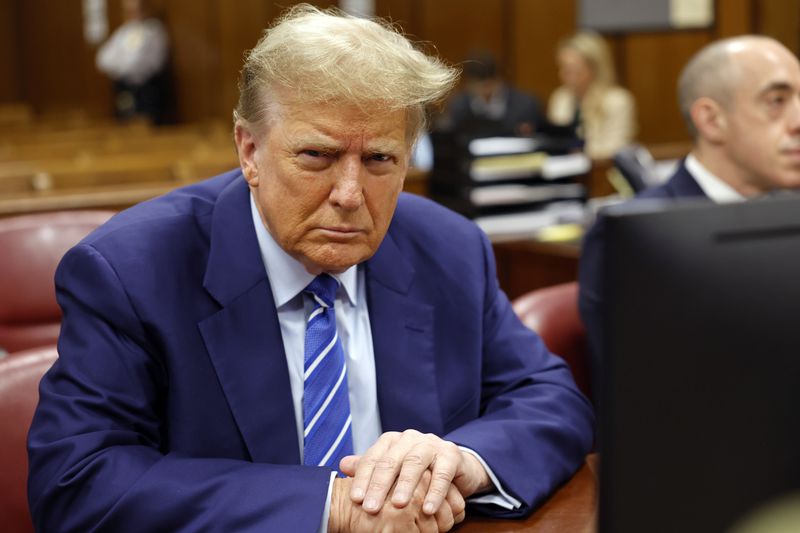 Former President Donald Trump awaits the start of proceedings on the second day of jury selection at Manhattan criminal court, Tuesday, April 16, 2024, in New York. Trump returned to the courtroom Tuesday as a judge works to find a panel of jurors who will decide whether the former president is guilty of criminal charges alleging he falsified business records to cover up a sex scandal during the 2016 campaign. (Michael M. Santiago/Pool Photo via AP)