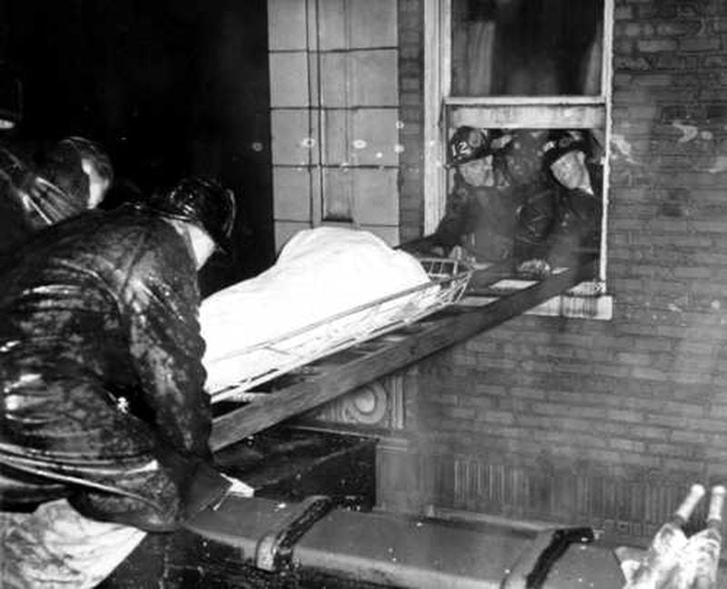 Atlanta firefighters remove bodies from the Winecoff Hotel on Dec. 7, 1946. The fire killed 119 people.