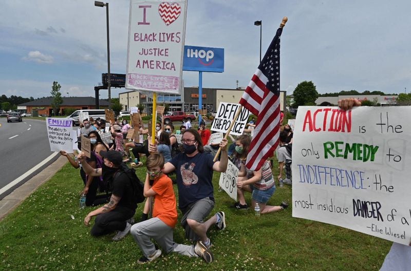 Teenagers helped organize a rally held Saturday afternoon in Forsyth County. (Photo: Hyosub Shin/AJC)