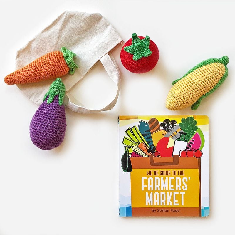 Food-curions toddlers will love an organic crochet vegetable rattle and board book about visiting the farmer's market.
Courtesy of Seed Factory