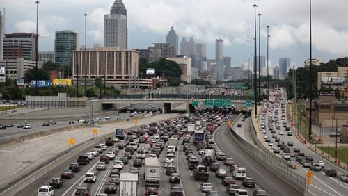 Long-term plans to improve traffic on the Downtown Connector have included tunneling underneath or adding lanes above. AJC file photo