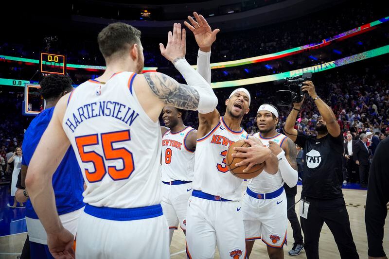 New York Knicks' Josh Hart (3) and teammate Isaiah Hartenstein (55) celebrate after winning Game 6 in an NBA basketball first-round playoff series against the Philadelphia 76ers, Thursday, May 2, 2024, in Philadelphia. (AP Photo/Matt Slocum)