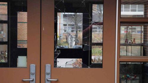 In this handout crime scene evidence photo provided by the Connecticut State Police, shows a damaged door of the Sandy Hook Elementary School following the December 14, 2012 shooting rampage, taken on an unspecified date in Newtown, Connecticut. A second report was released December 27, 2013 by Connecticut State Attorney Stephen Sedensky III gave more details of the the Newtown school shooting by Adam Lanza that left 20 children and six women educators dead inside Sandy Hook Elementary School after killing his mother at their home. (Photo by Connecticut State Police via Getty Images)