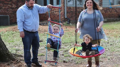 Melanie and Kris Lambert and their sons Connor, 5, and Harrison, 2, spend some family time in their backyard while preparing for the birth of their third son. Melanie says that worrying about COVID-19 became a part of her pregnancy. “I am a mask wearer and use hand sanitizer and we do things we need to do, but I just went into hyperdrive,” she said. (Curtis Compton / Curtis.Compton@ajc.com)