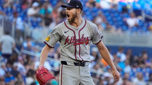 Atlanta Braves starting pitcher Chris Sale reacts after walking Miami Marlins' Jake Burger during the fifth inning of a baseball game, Saturday, April 13, 2024, in Miami. Miami won 5-1. (AP Photo/Wilfredo Lee)