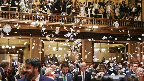 House members throw up paper at the conclusion of the legislative session in the House Chamber on Sine Die, the last day of the General Assembly at the Georgia State Capitol in Atlanta on Wednesday, March 29, 2023. Georgia lawmakers passed several bills in the session's final days that could impact higher education in the state. (Natrice Miller / natrice.miller@ajc.com)