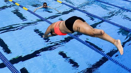 A member of the U.S. Special Operations Command’s adaptive sports program team dives into a pool during an event in Tampa, Fla., March 3, 2016. Cherokee County is seeking a $30,000 federal grant to start an adaptive sports program, including swimming, for disabled veterans. U.S. AIR FORCE PHOTO